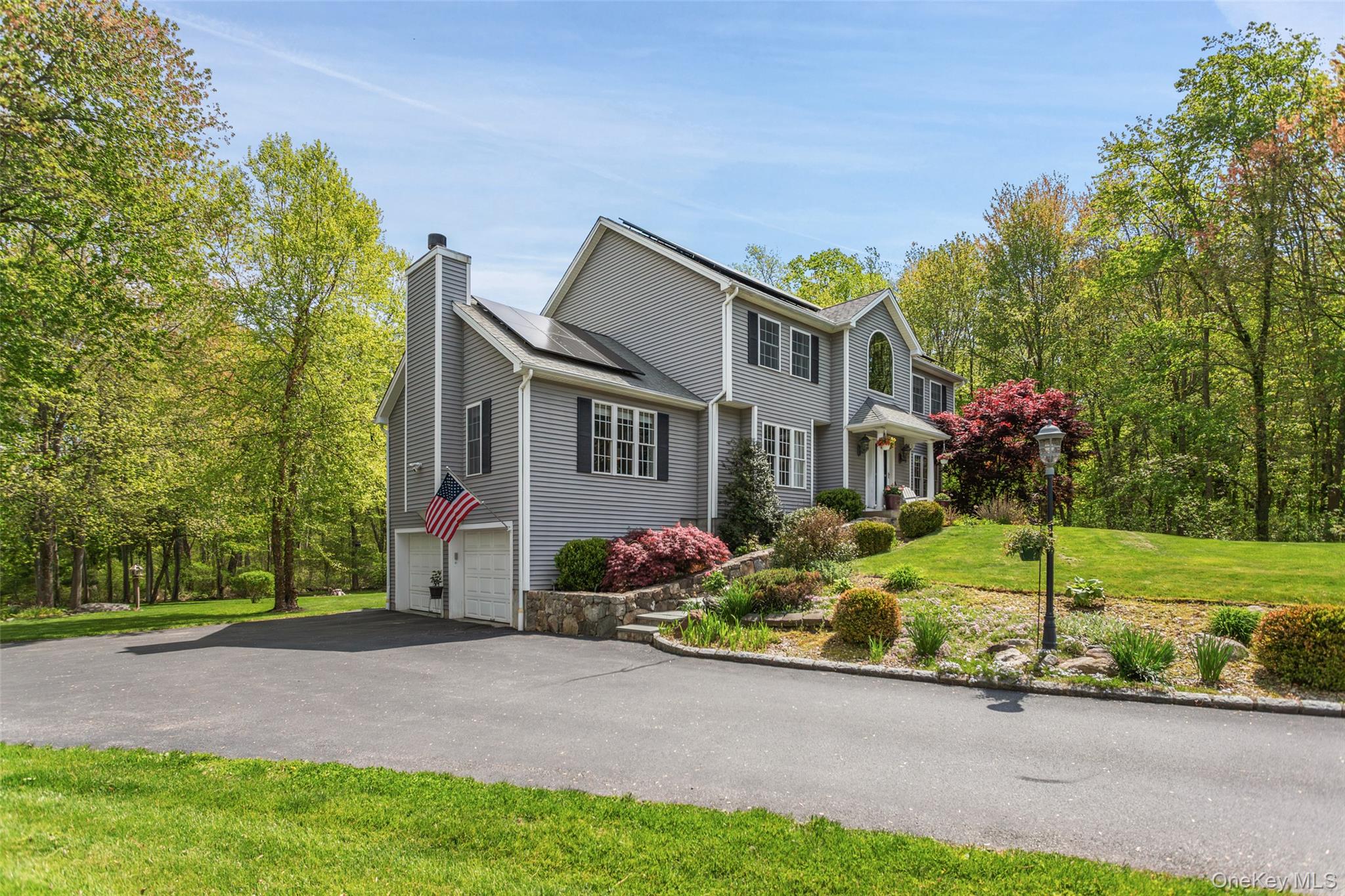 754 Milltown Road Danbury, CT 06811 - Photo 2 of 41 a front view of a house with garden