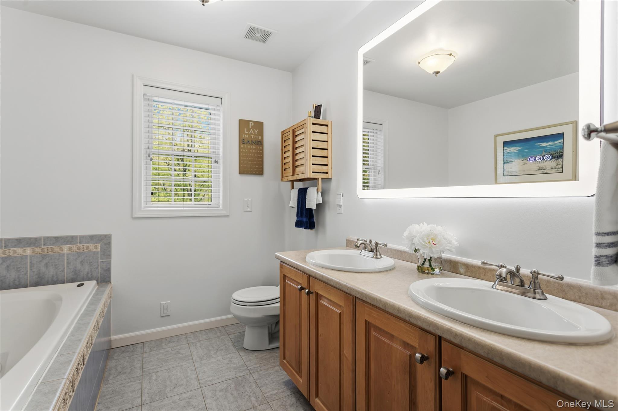 754 Milltown Road Danbury, CT 06811 - Photo 24 of 41 a bathroom with a double vanity sink toilet and a bathtub