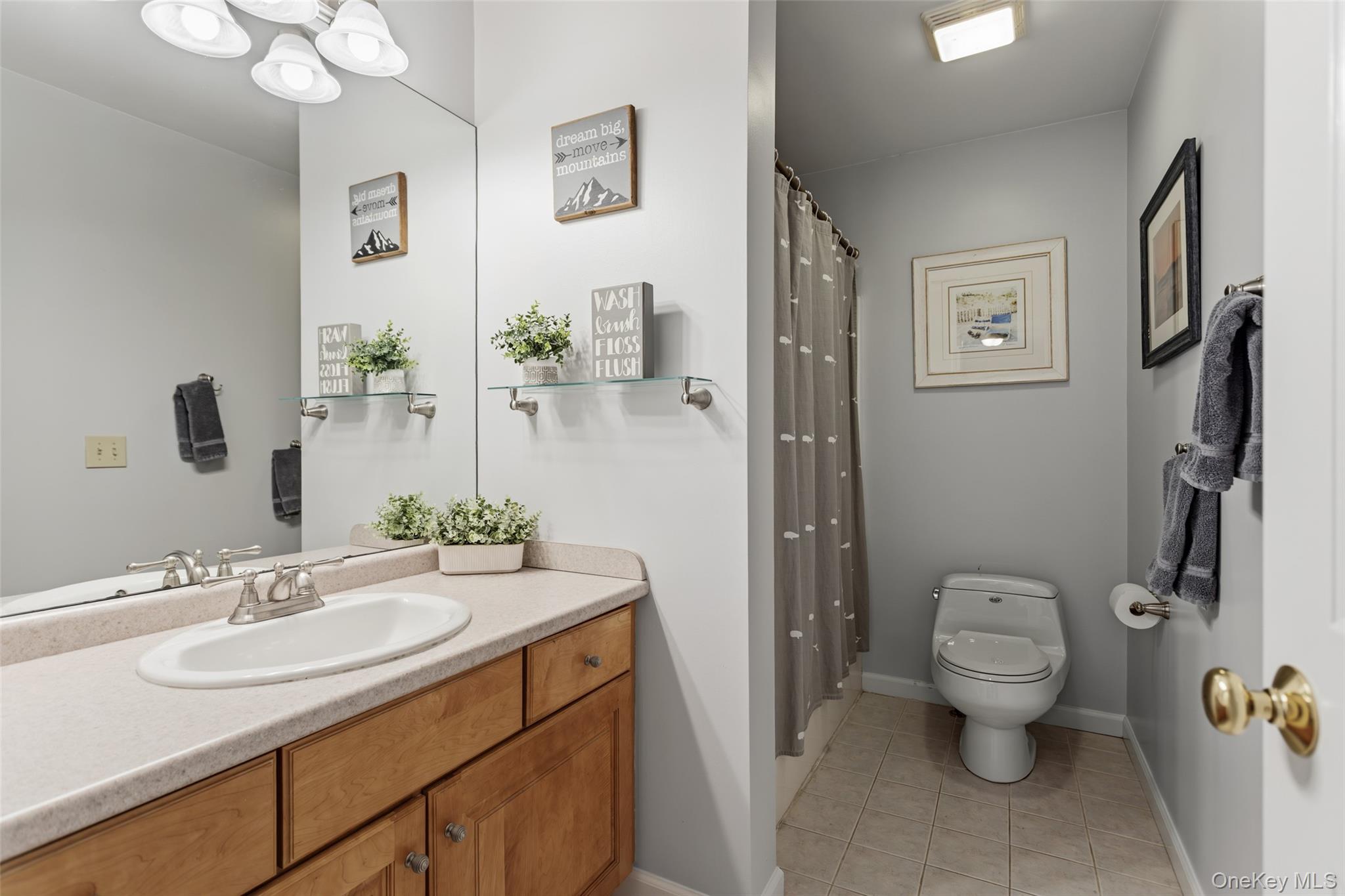 754 Milltown Road Danbury, CT 06811 - Photo 28 of 41 a bathroom with a sink toilet and a mirror