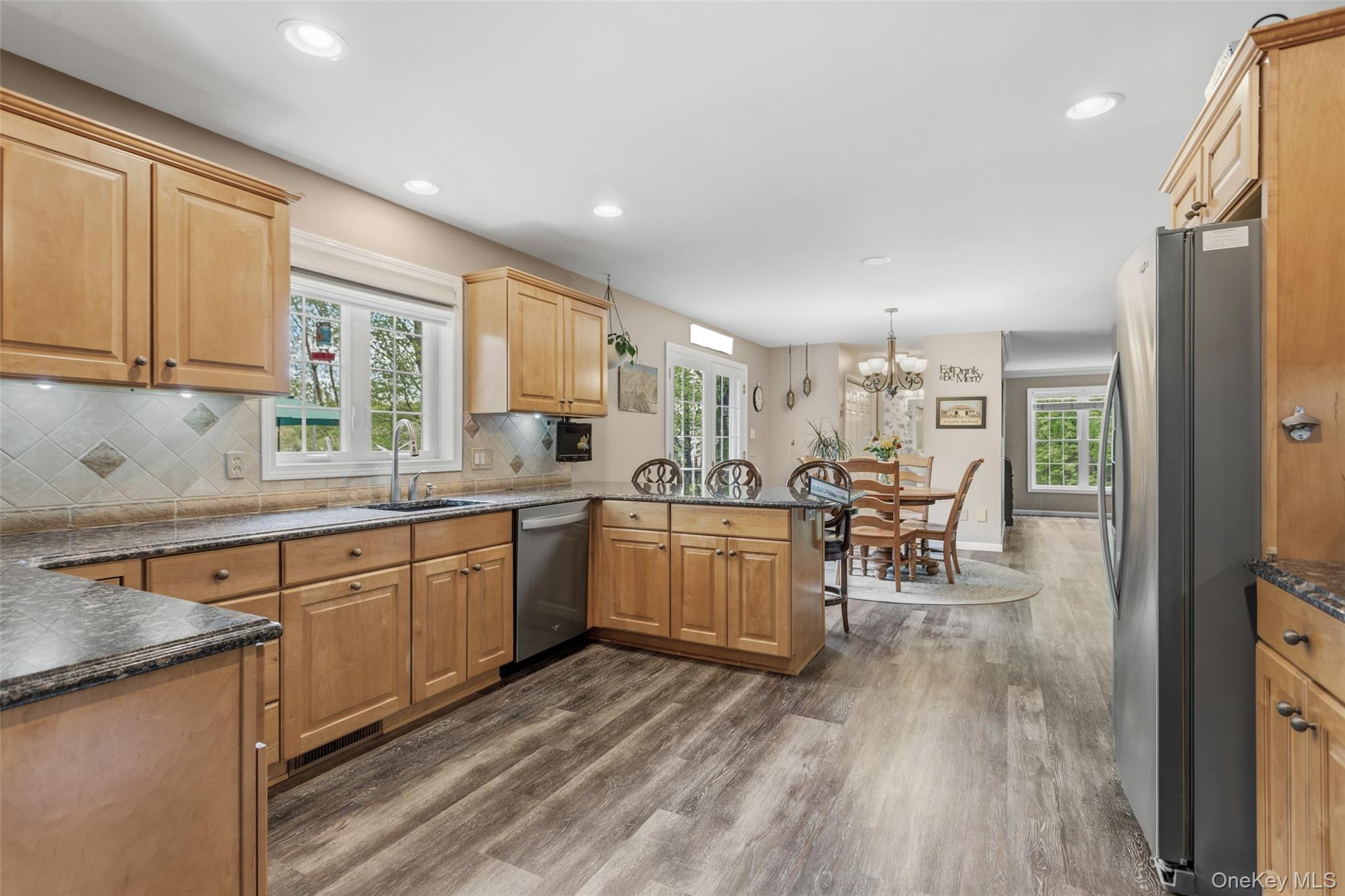 754 Milltown Road Danbury, CT 06811 - Photo 9 of 41 a kitchen with sink cabinets and wooden floor