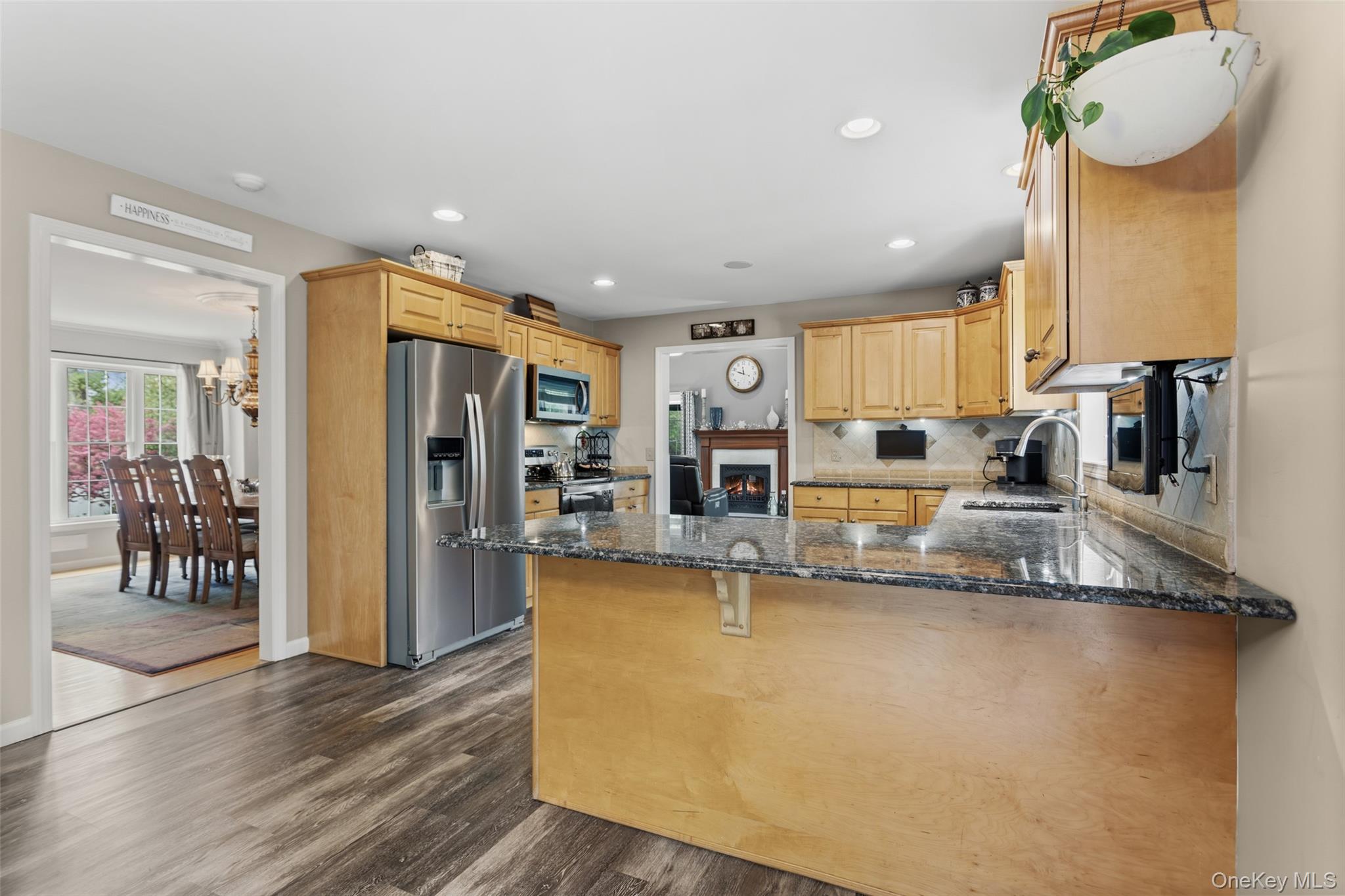 754 Milltown Road Danbury, CT 06811 - Photo 10 of 41 a kitchen with stainless steel appliances granite countertop a refrigerator a sink and a stove with wooden floor