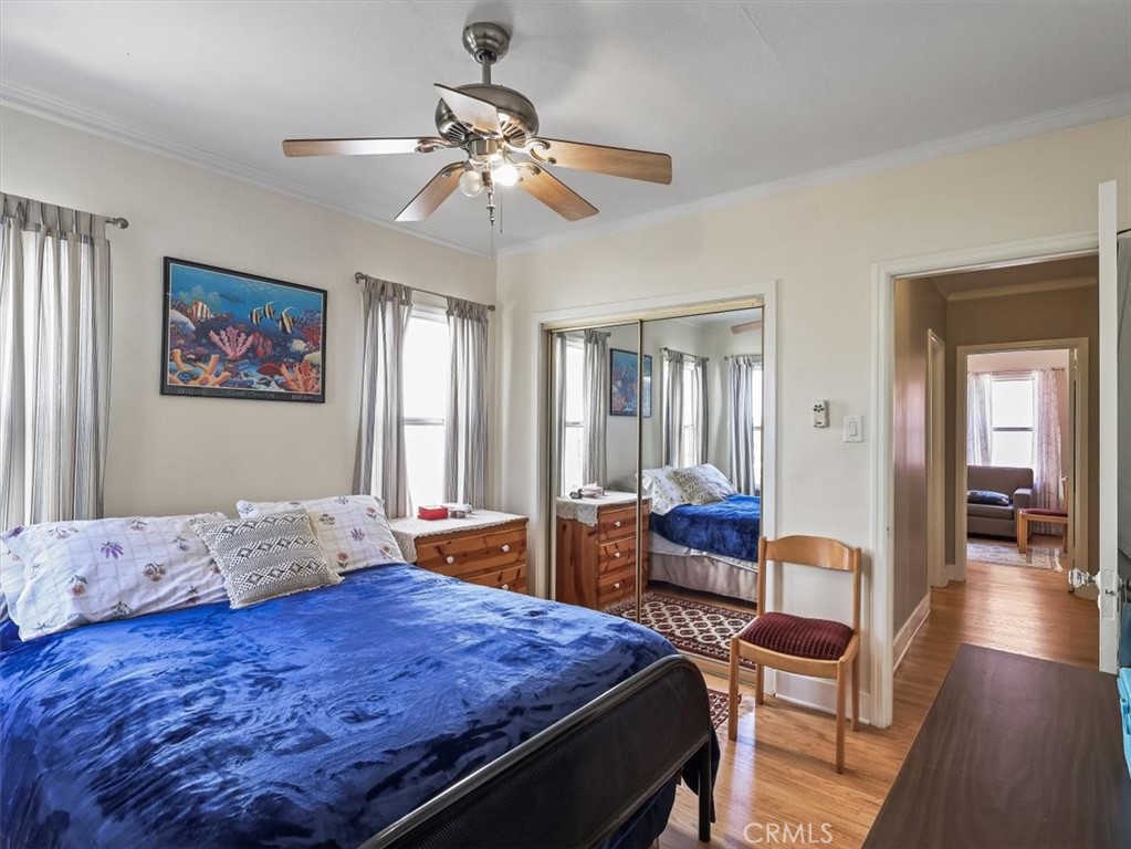 945 Rosemount Road Glendale, CA 91207 - Photo 28 of 31 a bedroom with a bed and wooden floor