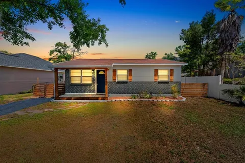 a front view of a house with yard