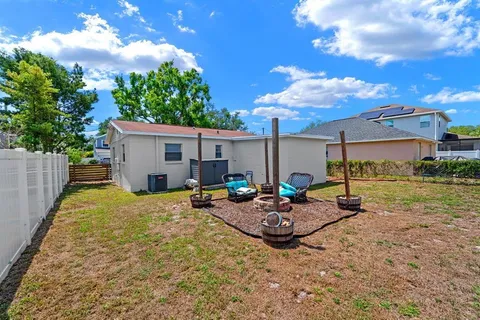 a view of a backyard with plants and a patio