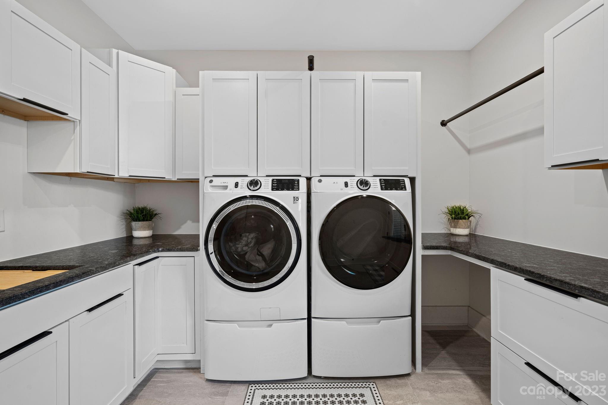 9622 Beatties Ford Road Huntersville, NC 28078 - Photo 17 of 48 a utility room with sink dryer and washer