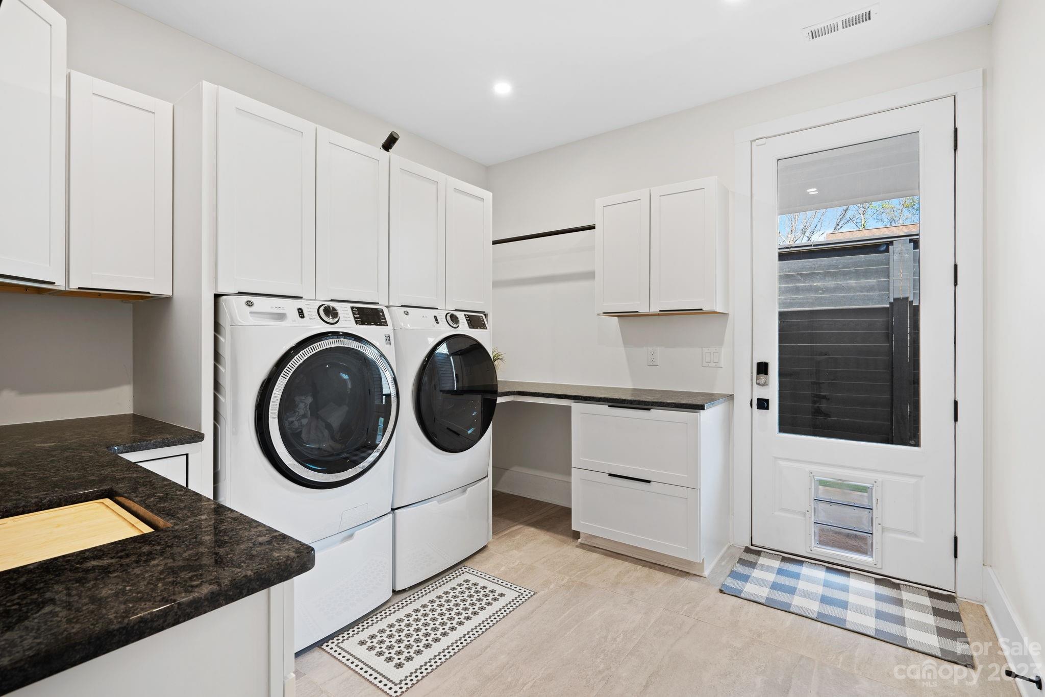 9622 Beatties Ford Road Huntersville, NC 28078 - Photo 18 of 48 a utility room with sink dryer and washer