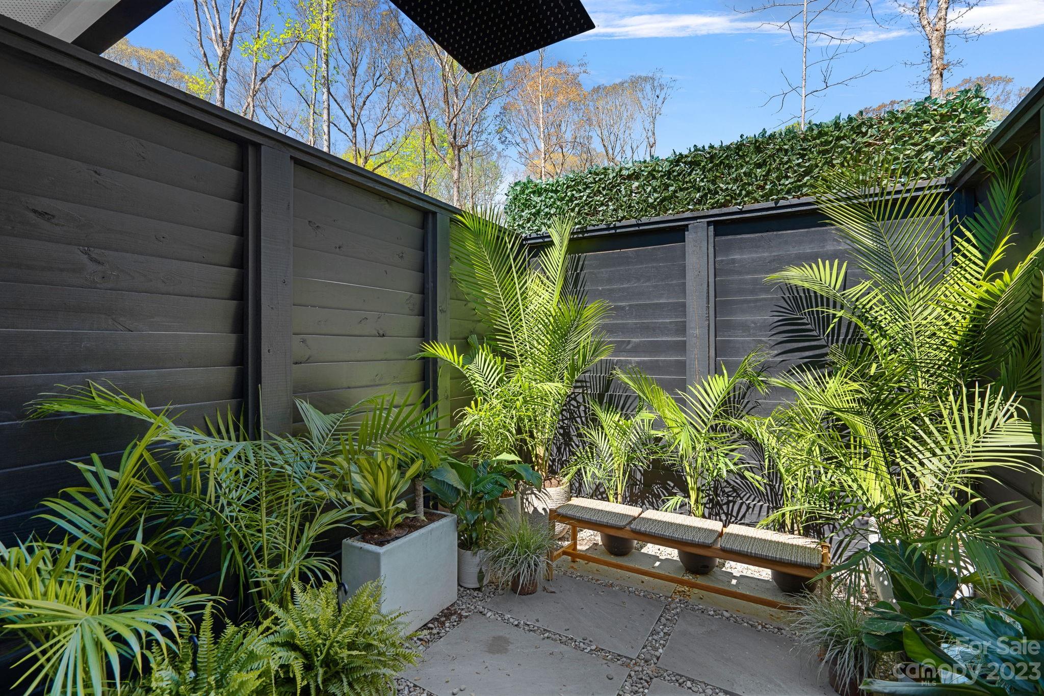 9622 Beatties Ford Road Huntersville, NC 28078 - Photo 23 of 48 a backyard with plants