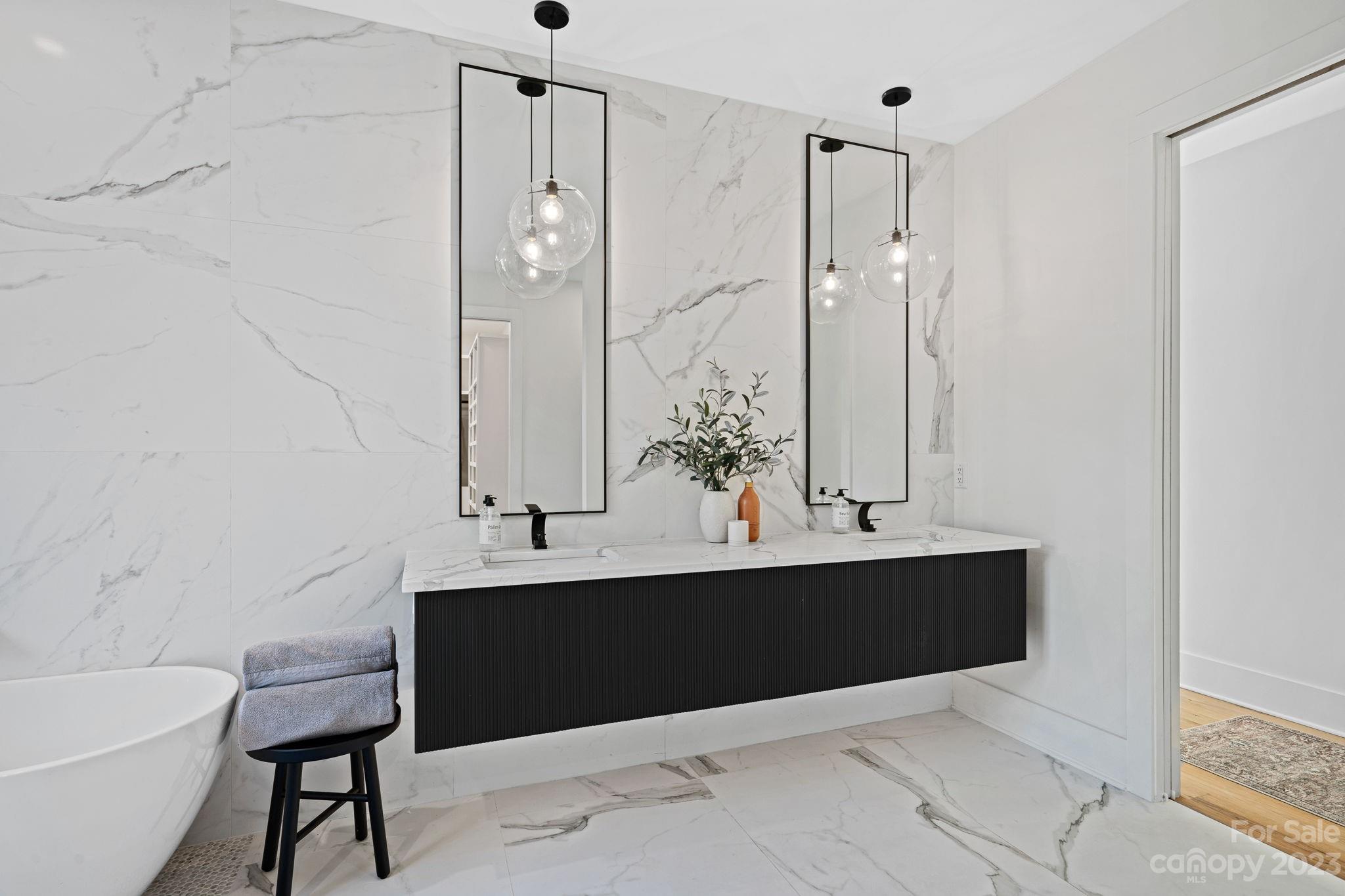 9622 Beatties Ford Road Huntersville, NC 28078 - Photo 24 of 48 a view of bathroom with a sink and mirror with shower