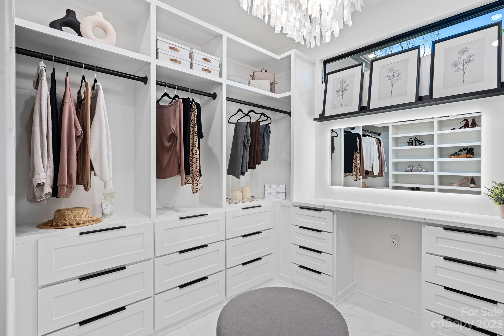 9622 Beatties Ford Road Huntersville, NC 28078 - Photo 26 of 48 a view of walk in closet with clothes and shoes