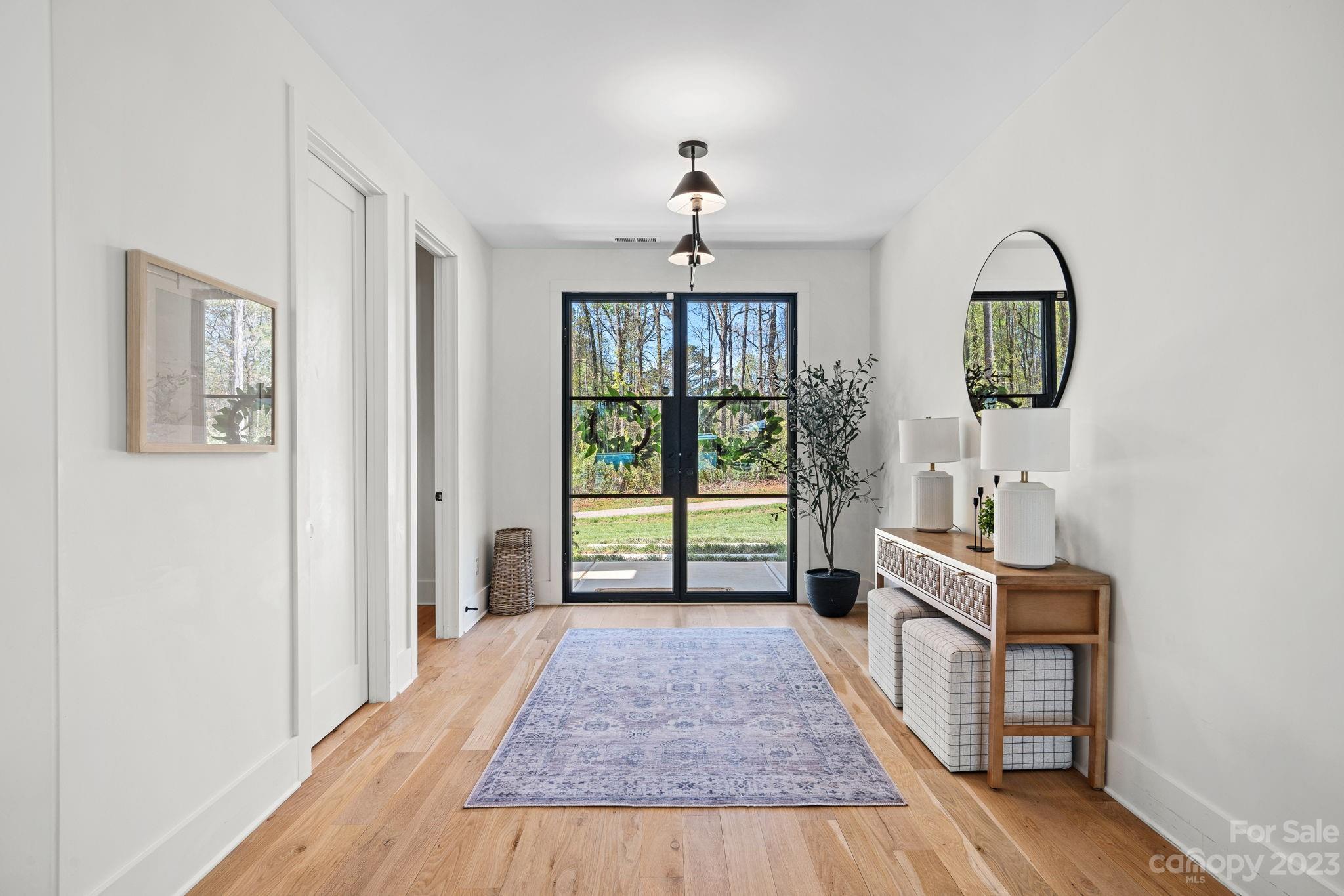 9622 Beatties Ford Road Huntersville, NC 28078 - Photo 3 of 48 a living room with furniture and a window