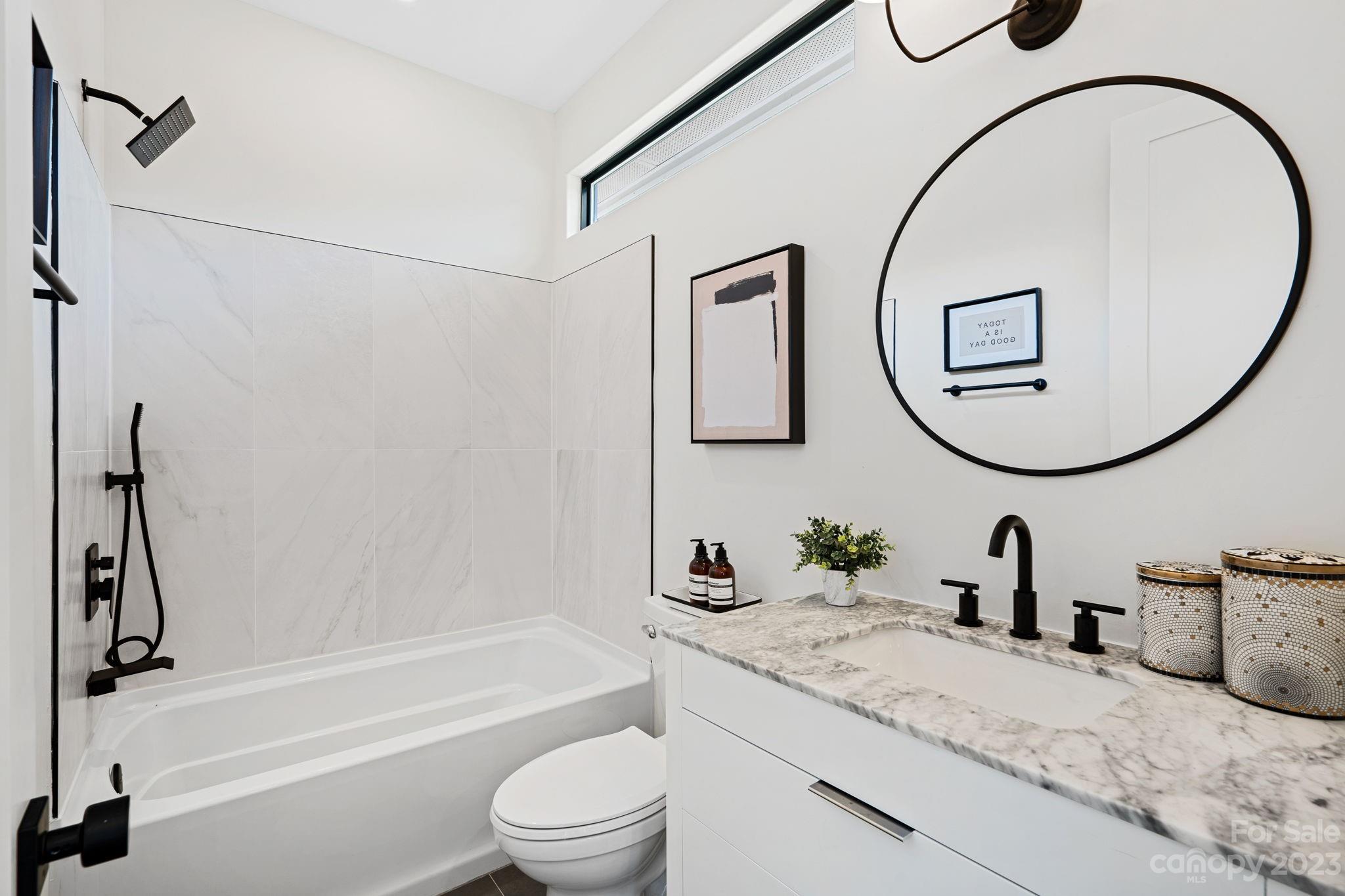 9622 Beatties Ford Road Huntersville, NC 28078 - Photo 31 of 48 a bathroom with a sink and a mirror