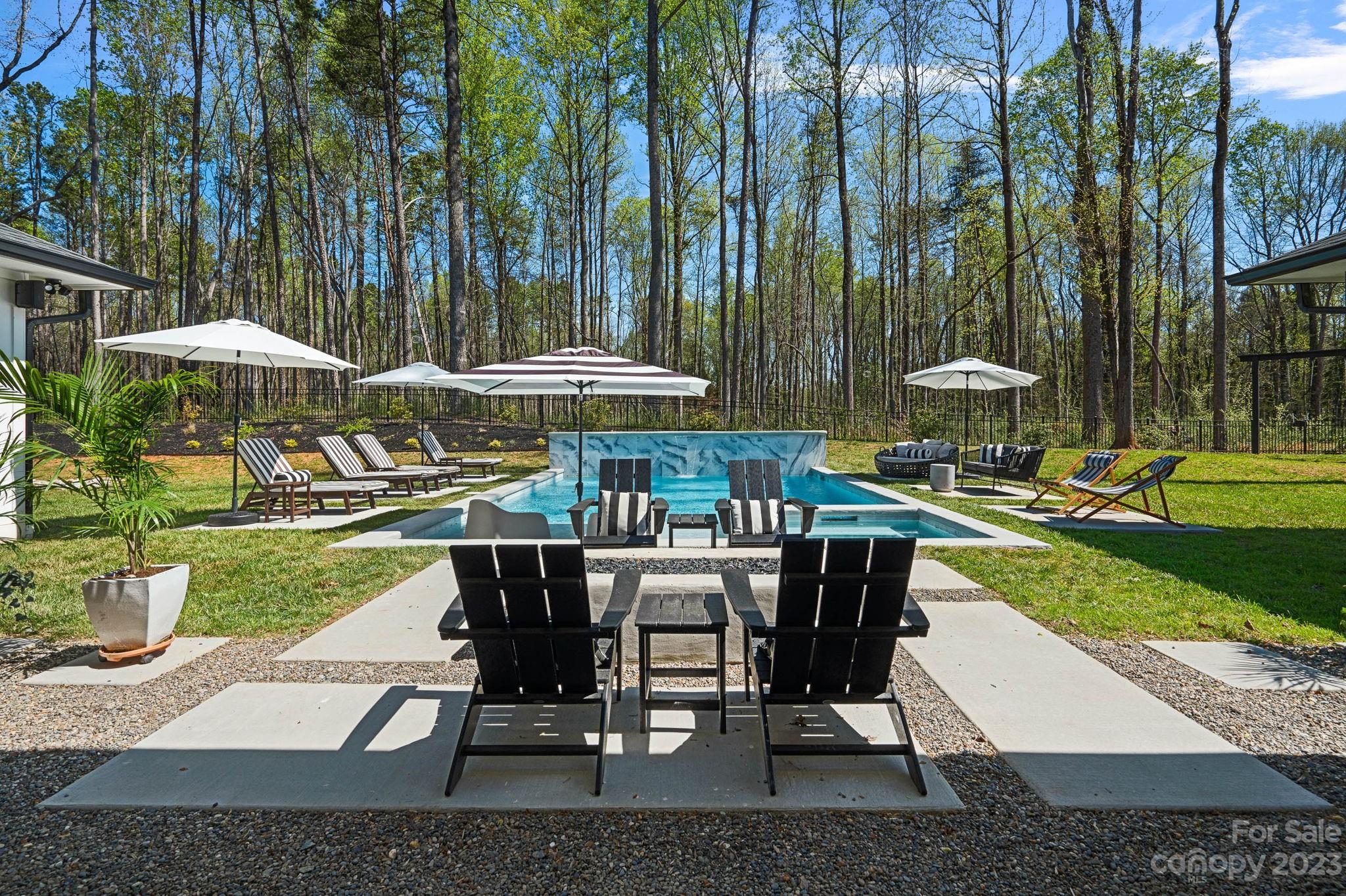 9622 Beatties Ford Road Huntersville, NC 28078 - Photo 39 of 48 an outdoor space with patio and white umbrellas