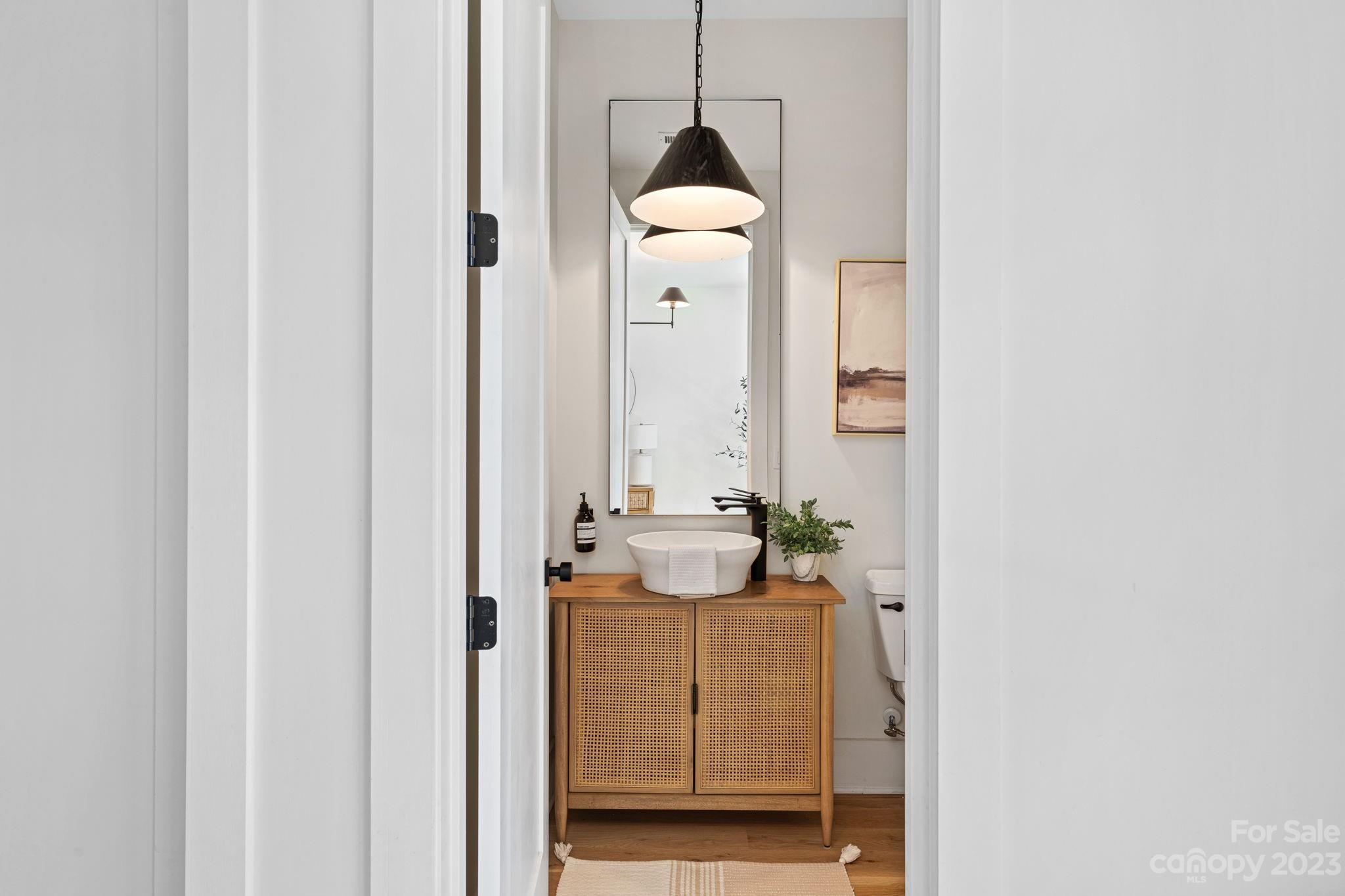 9622 Beatties Ford Road Huntersville, NC 28078 - Photo 4 of 48 a bathroom with a sink and mirror