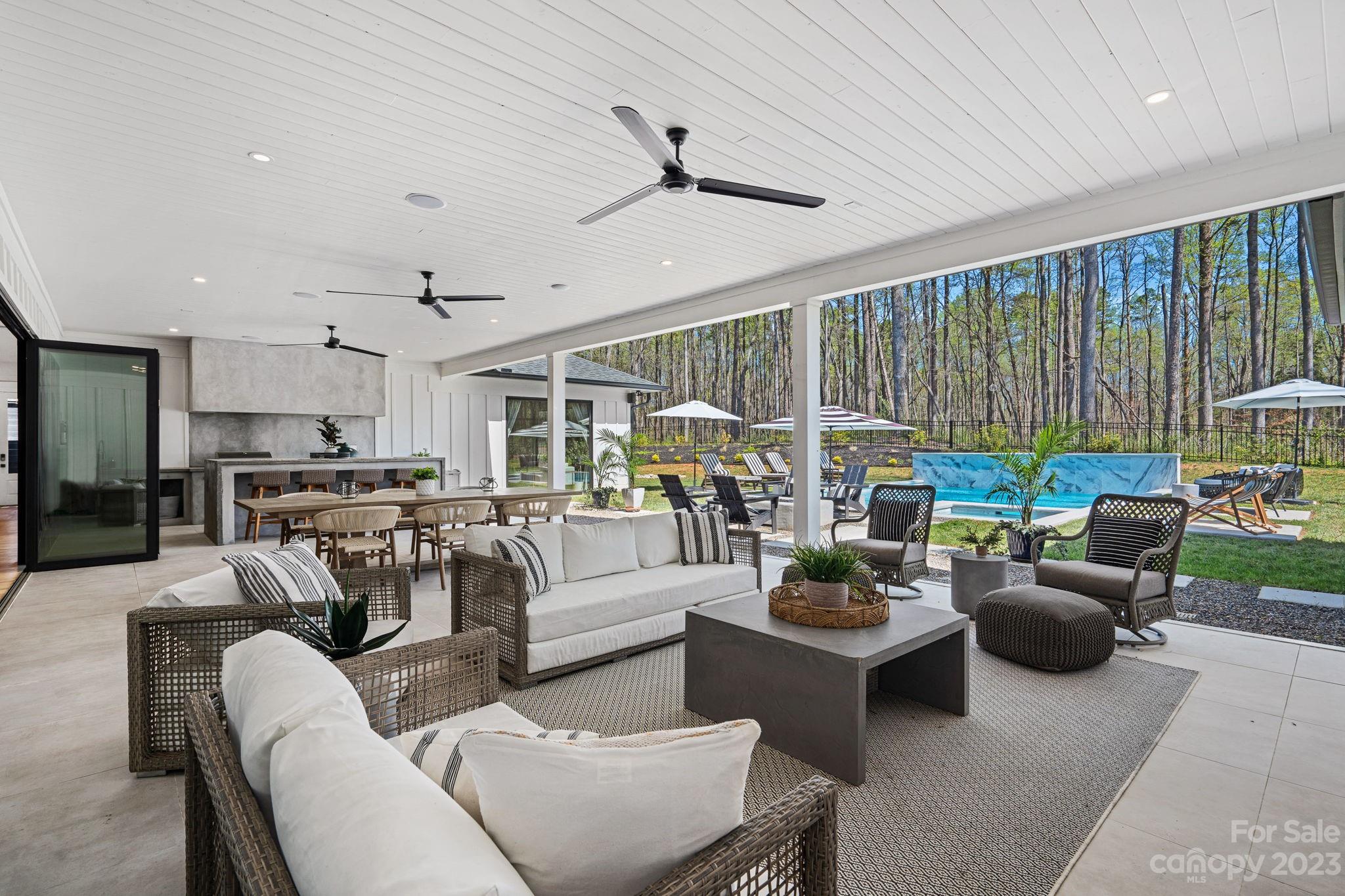 9622 Beatties Ford Road Huntersville, NC 28078 - Photo 41 of 48 a living room with furniture fireplace and a large window