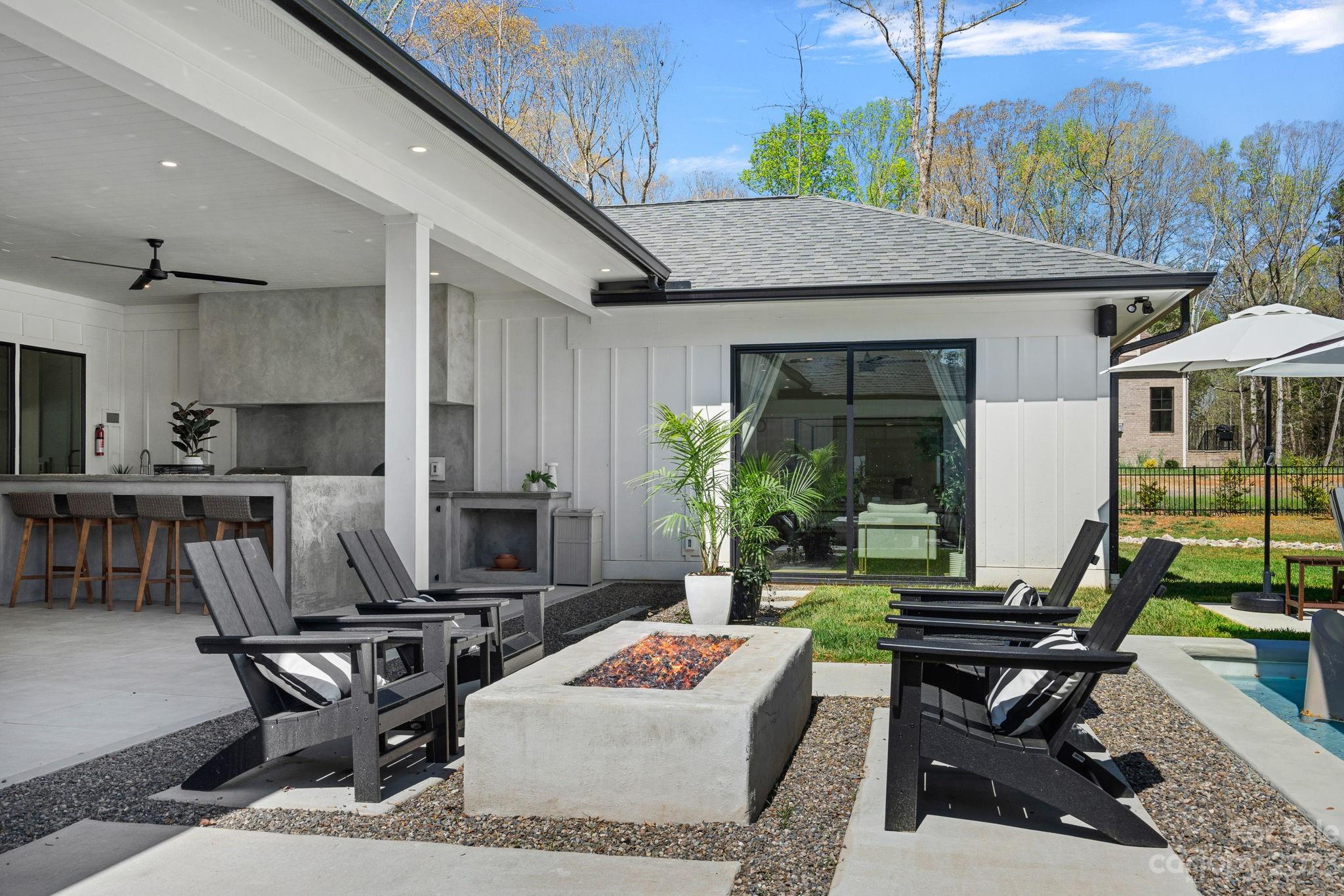 9622 Beatties Ford Road Huntersville, NC 28078 - Photo 45 of 48 a backyard of a house with outdoor seating