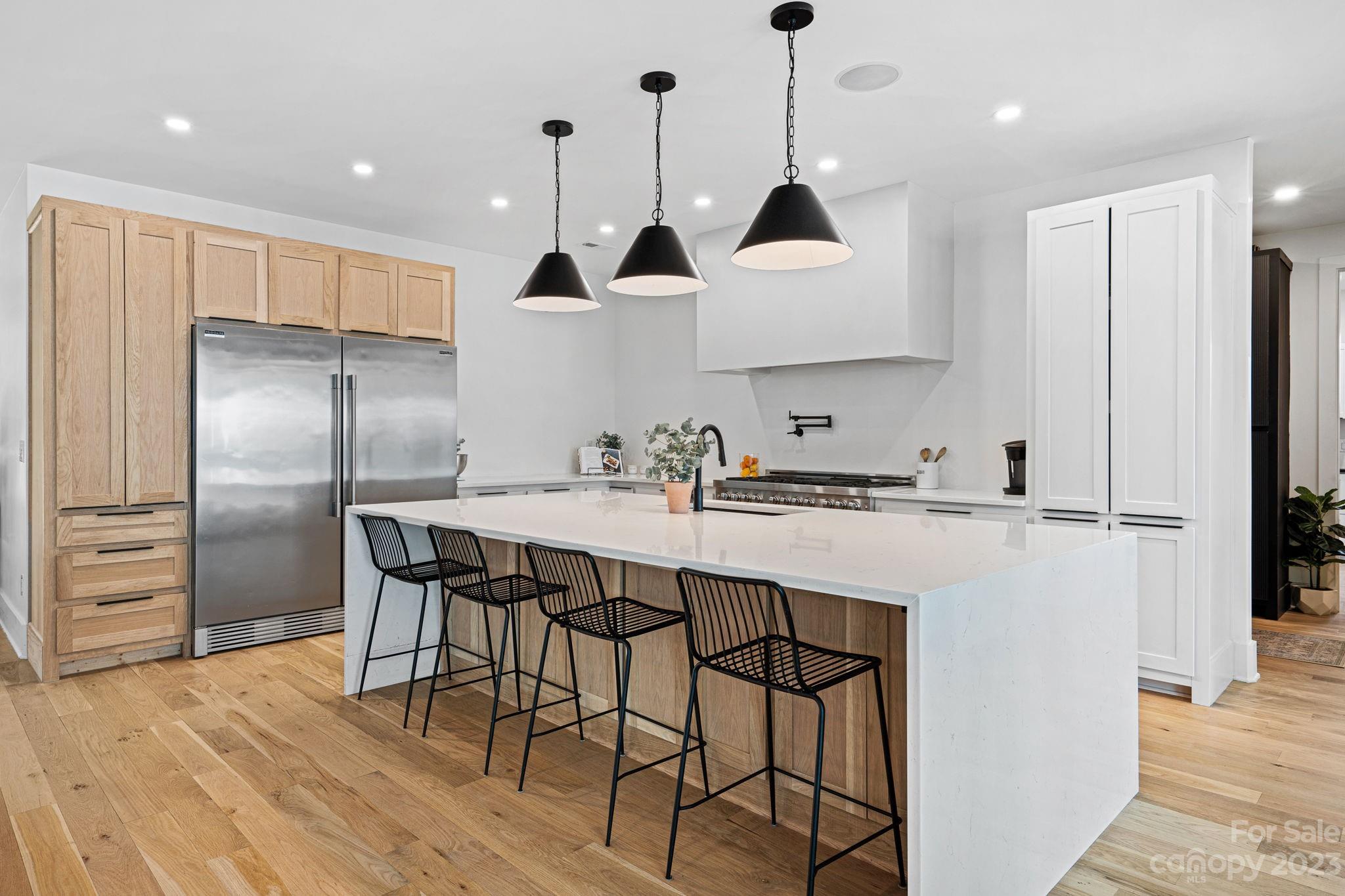 9622 Beatties Ford Road Huntersville, NC 28078 - Photo 8 of 48 a kitchen with stainless steel appliances granite countertop a sink a stove and a refrigerator