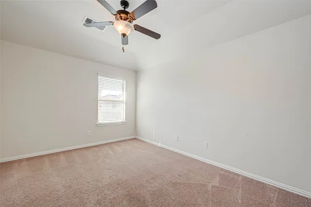 a bathroom with a sink a toilet a mirror a bathtub and shower