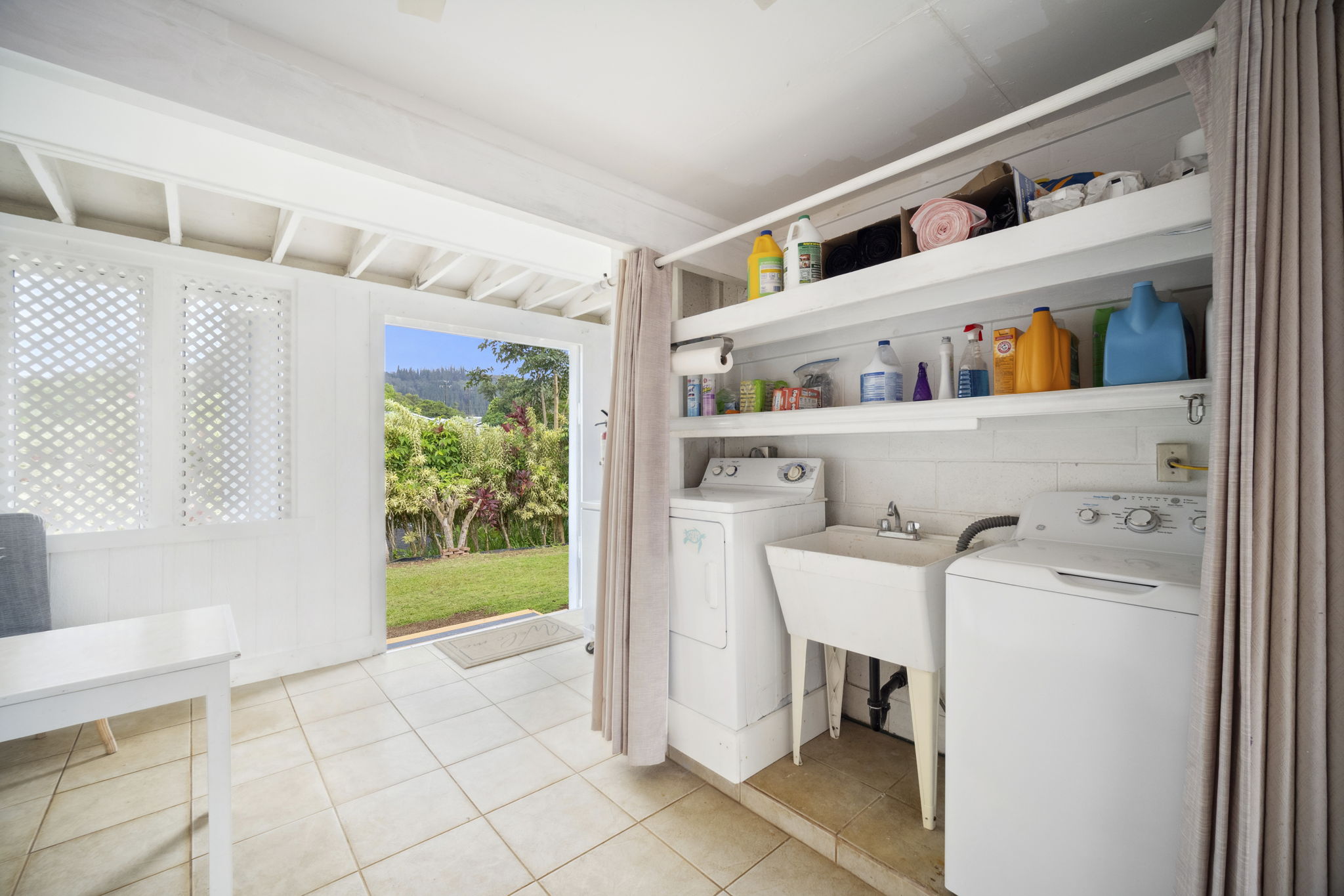 4439 Punee Road Koloa, HI 96756 - Photo 22 of 30 a utility room with dryer and washer
