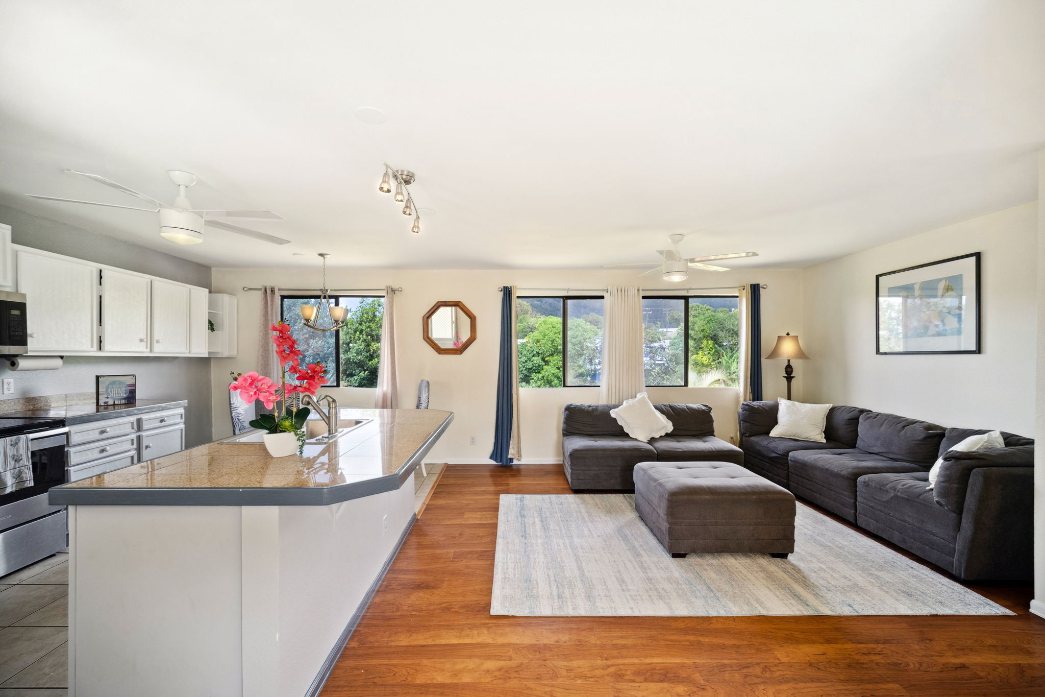 4439 Punee Road Koloa, HI 96756 - Photo 4 of 30 a living room with furniture and a wooden floor