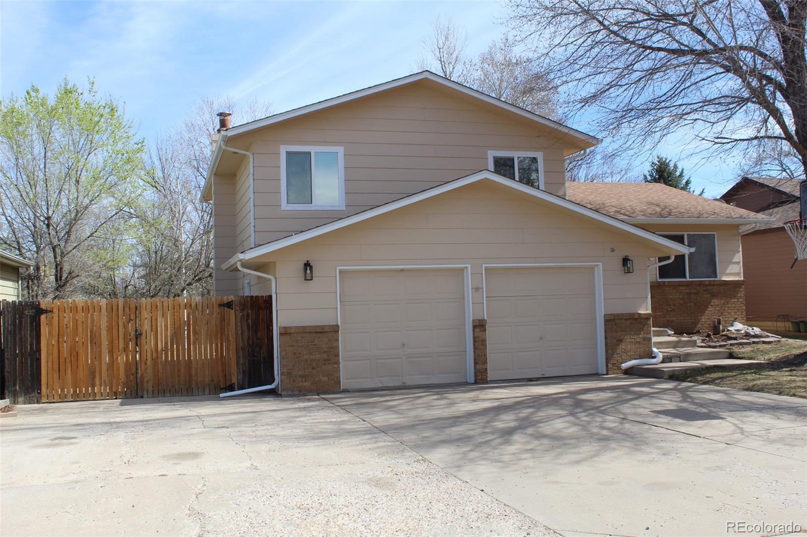 a view of a house with a yard and garage