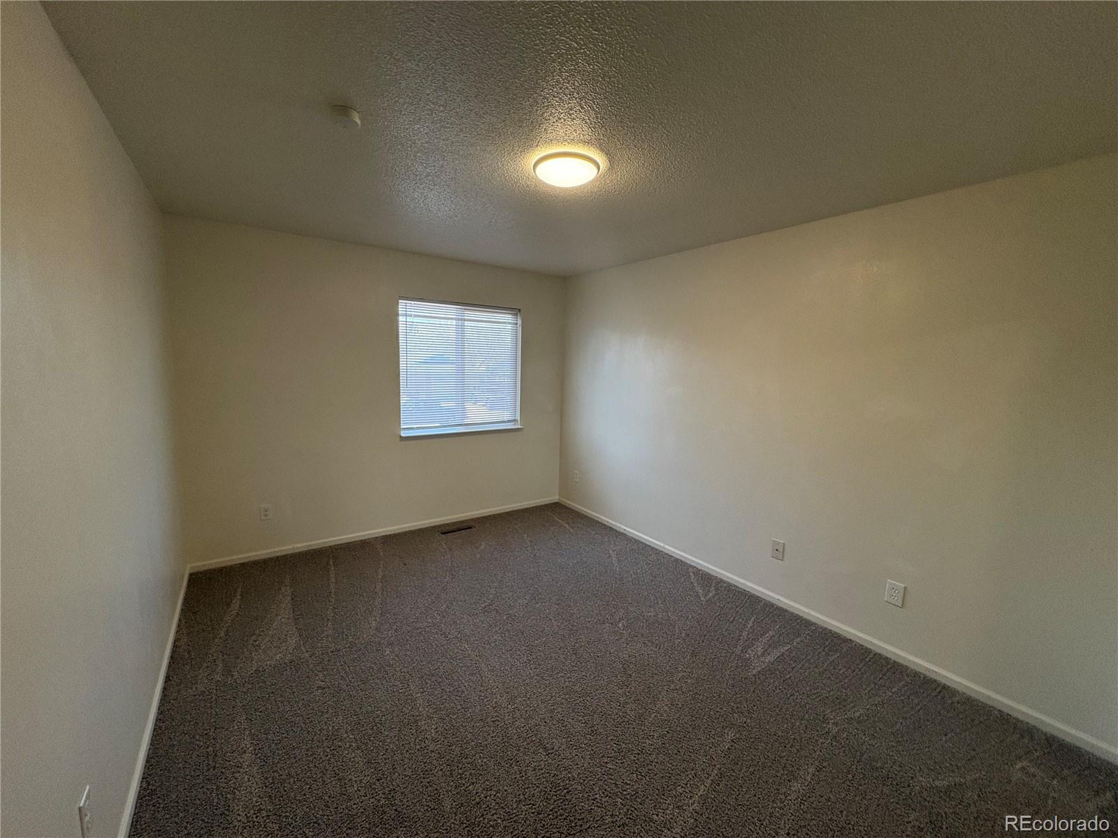 138 48th Avenue Greeley, CO 80634 - Photo 14 of 29 an empty room with a window
