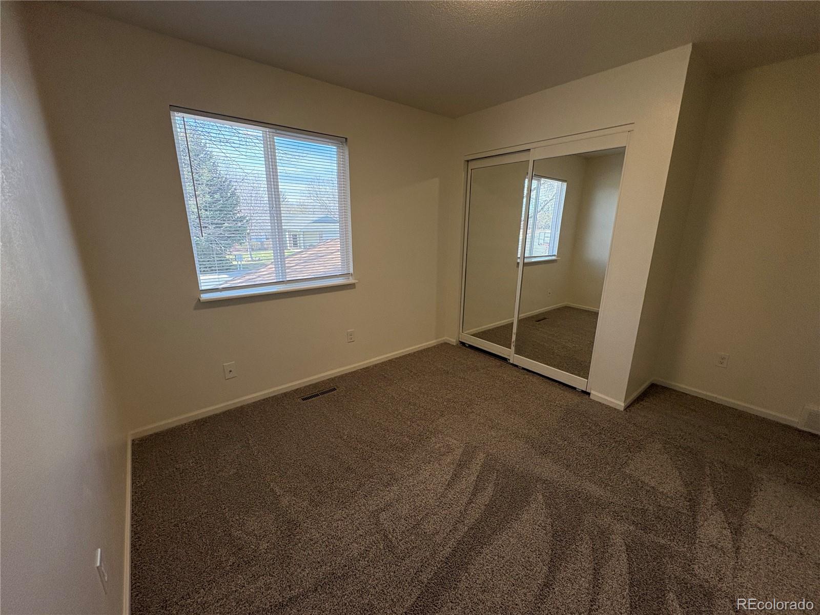 138 48th Avenue Greeley, CO 80634 - Photo 16 of 29 an empty room with windows