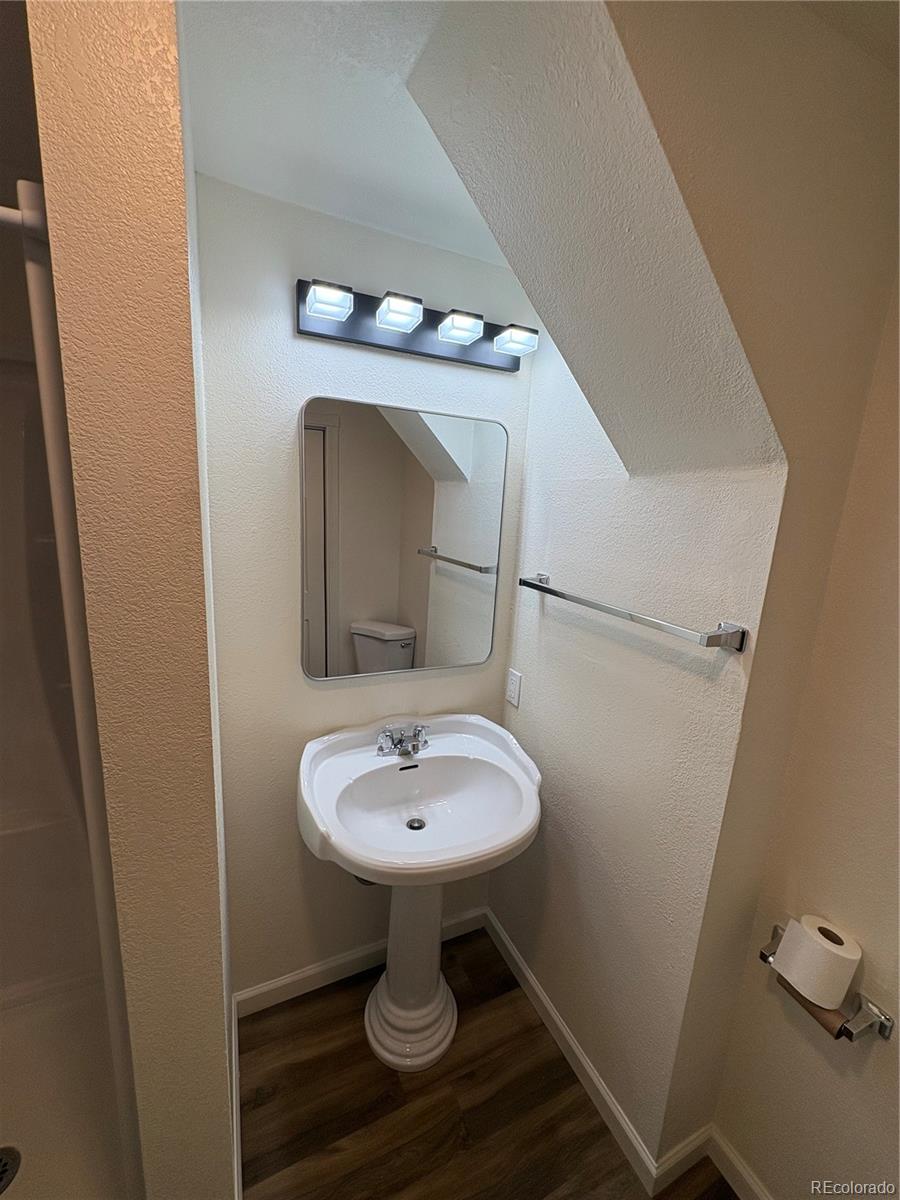 138 48th Avenue Greeley, CO 80634 - Photo 18 of 29 a bathroom with a sink toilet and a mirror