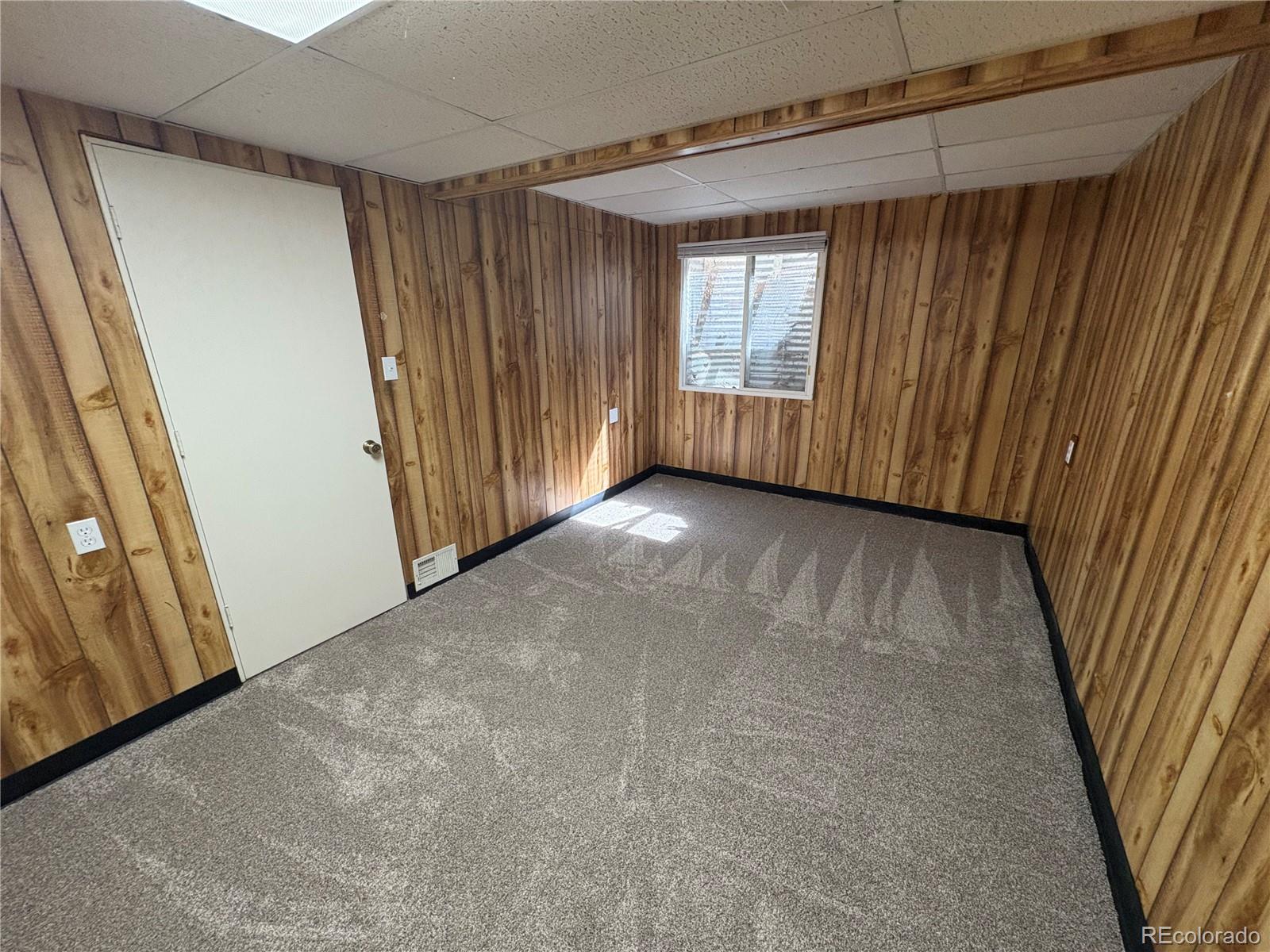 138 48th Avenue Greeley, CO 80634 - Photo 20 of 29 a view of an empty room with a window