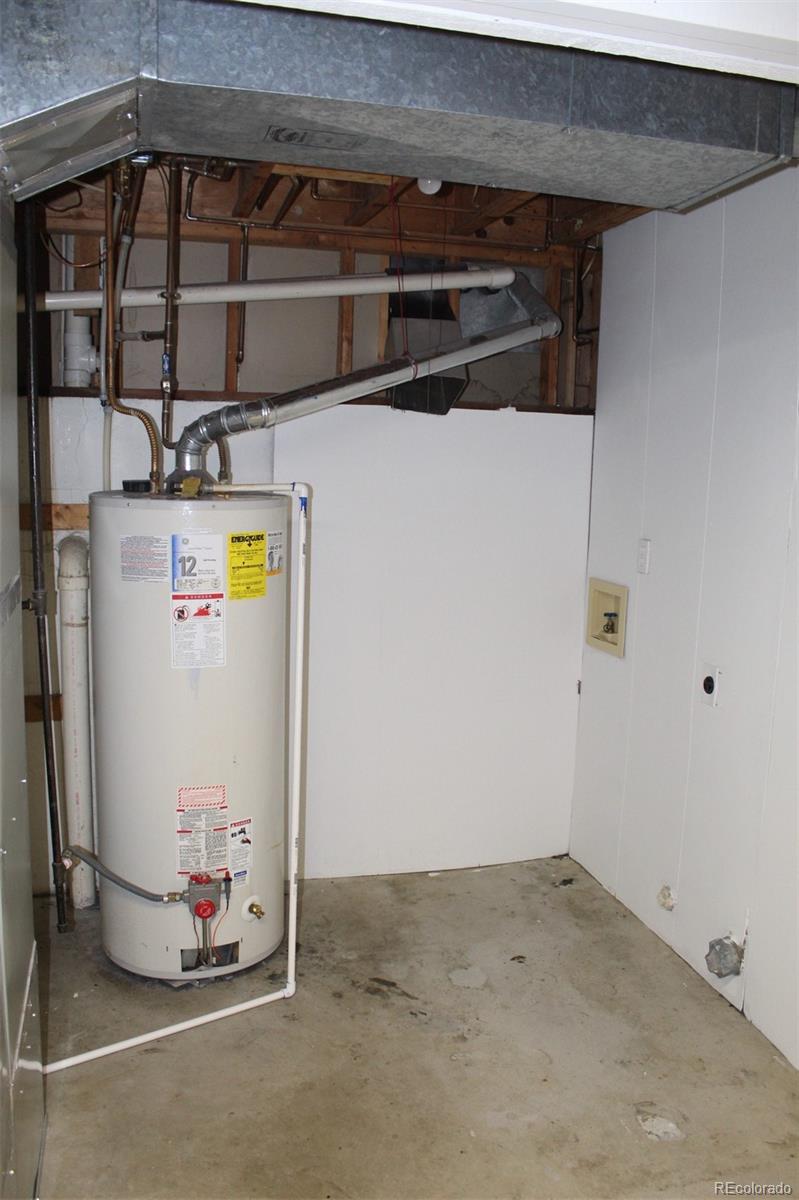 138 48th Avenue Greeley, CO 80634 - Photo 21 of 29 a utility room with a refrigerator and window