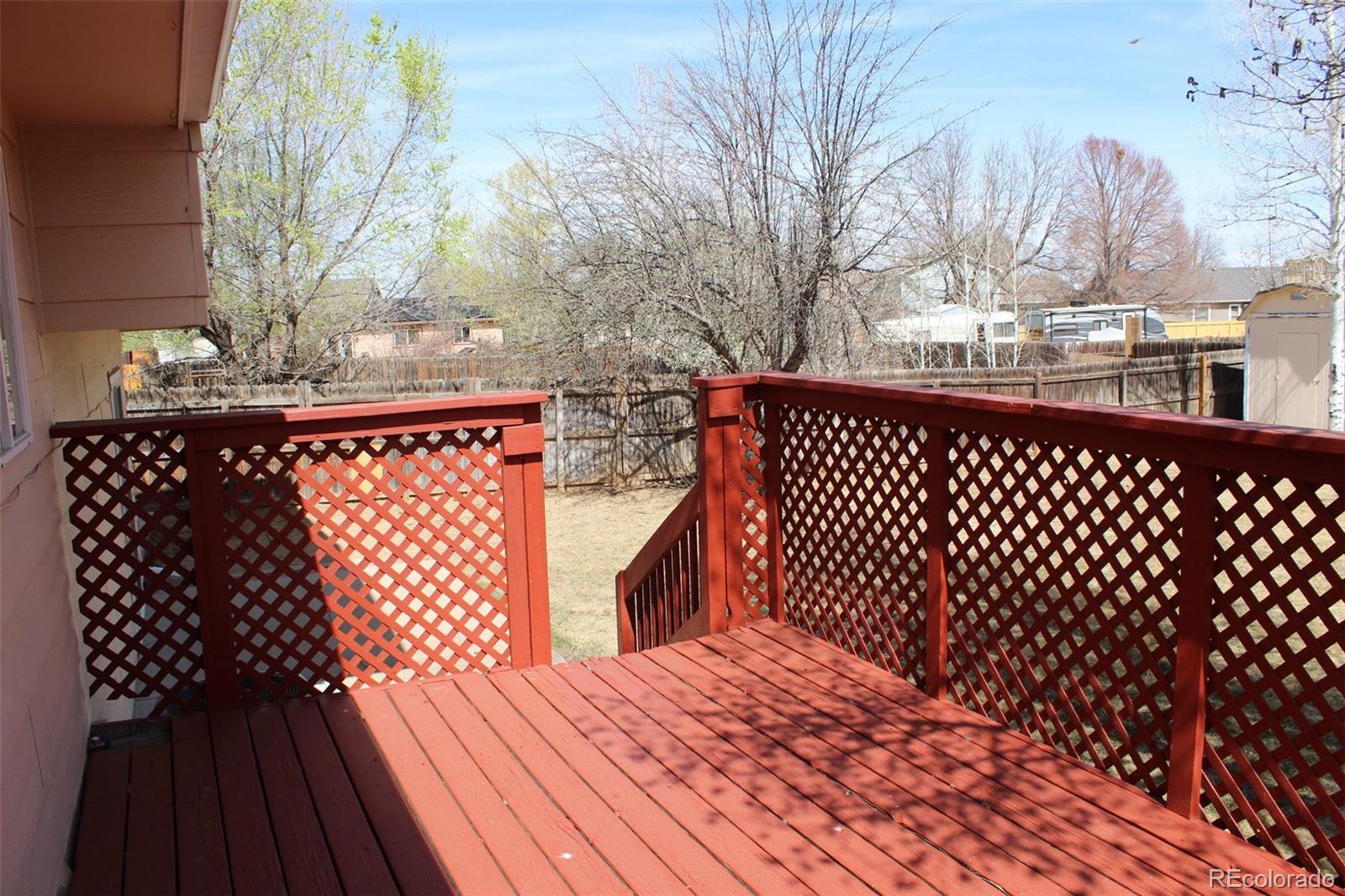 138 48th Avenue Greeley, CO 80634 - Photo 24 of 29 a view of a wooden roof deck