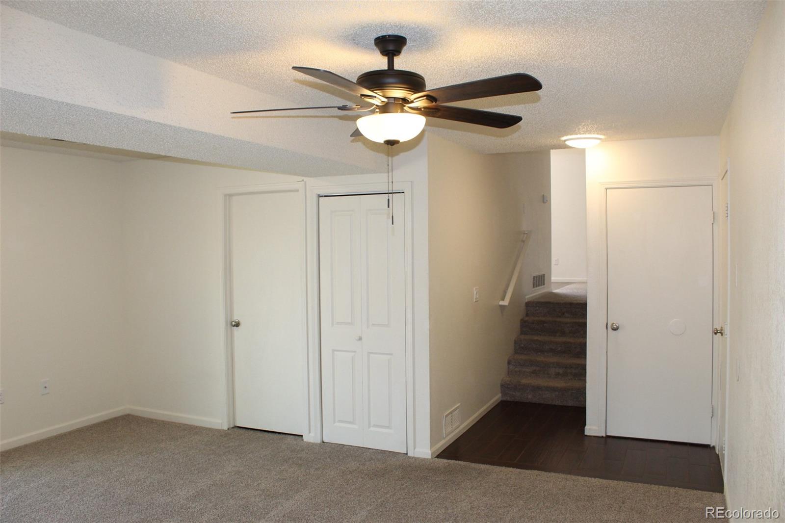 138 48th Avenue Greeley, CO 80634 - Photo 6 of 29 a view of a chandelier fan and entryway
