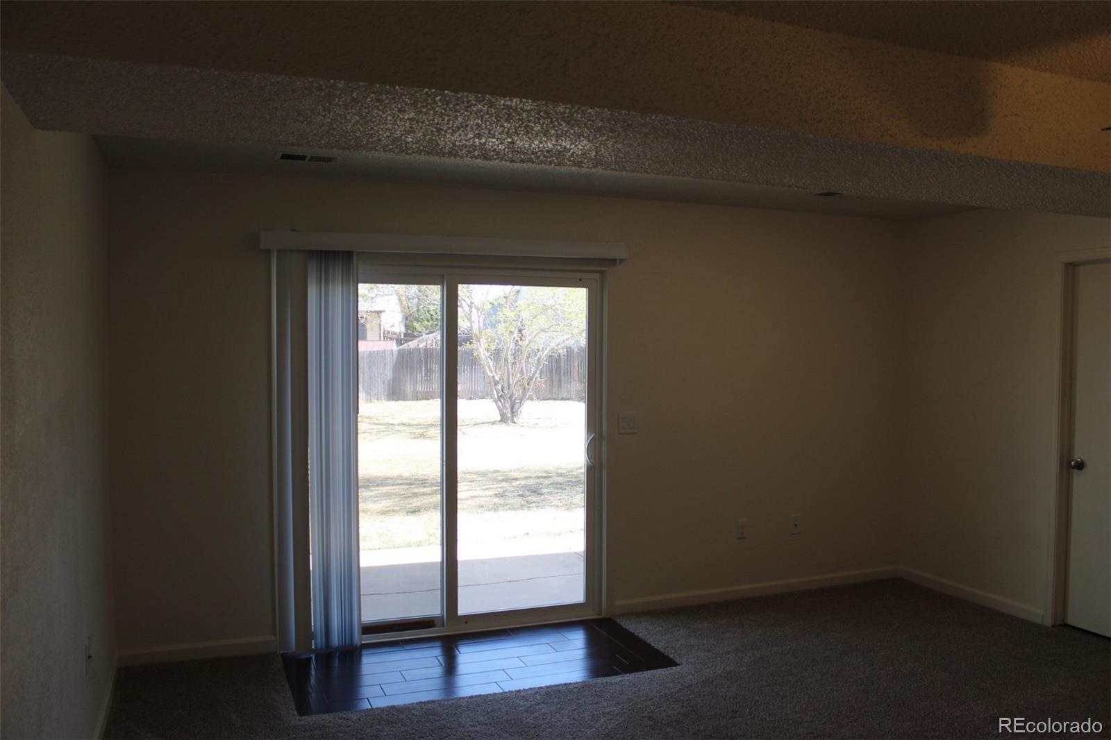 138 48th Avenue Greeley, CO 80634 - Photo 7 of 29 a view of an empty room with a window