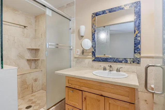 a bathroom with a sink and mirror