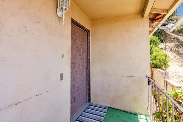 a view of room with window and ceiling fan