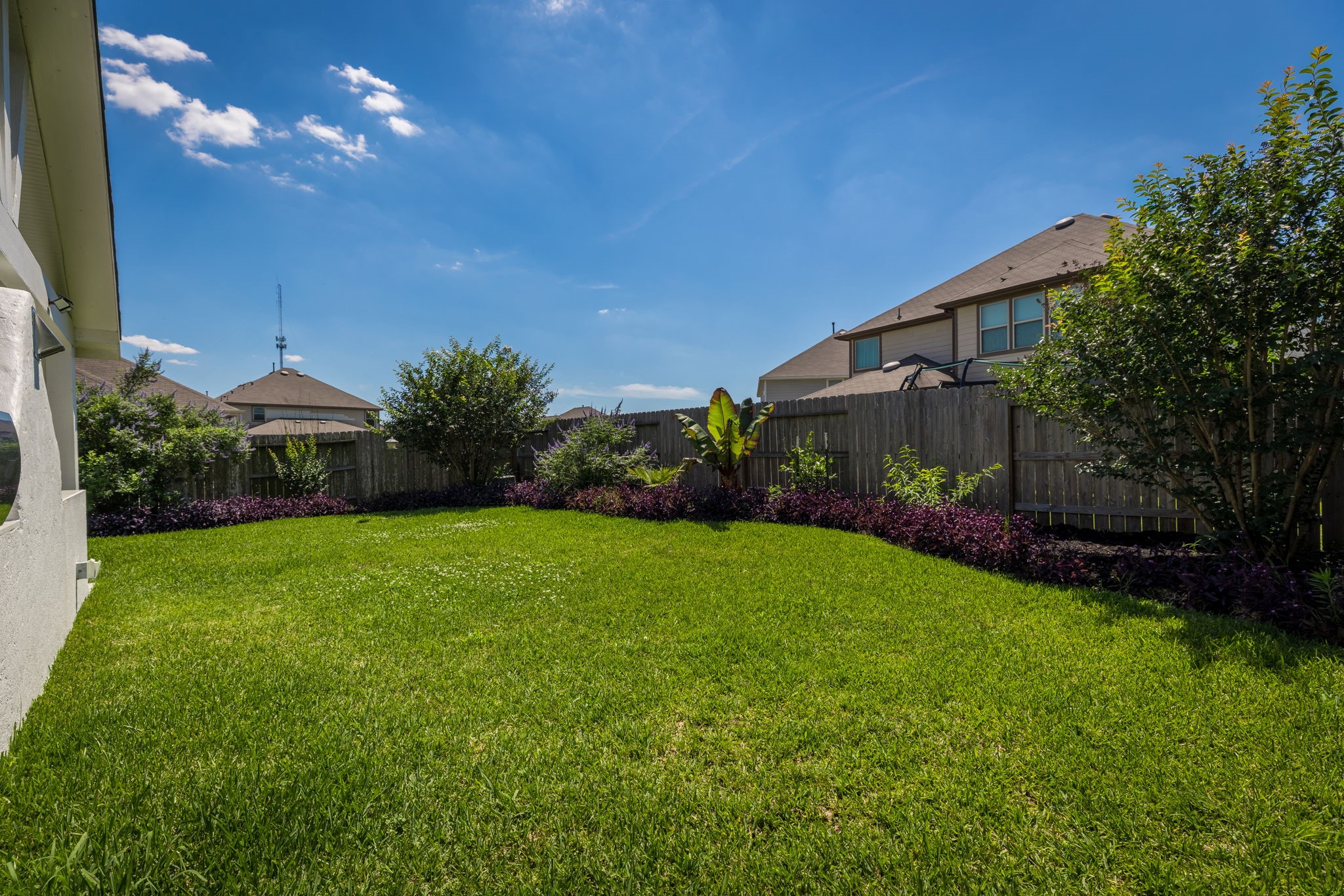 5127 Avondale Rise Street Katy, TX 77493 - Photo 46 of 47 a view of a backyard with potted plants and big trees