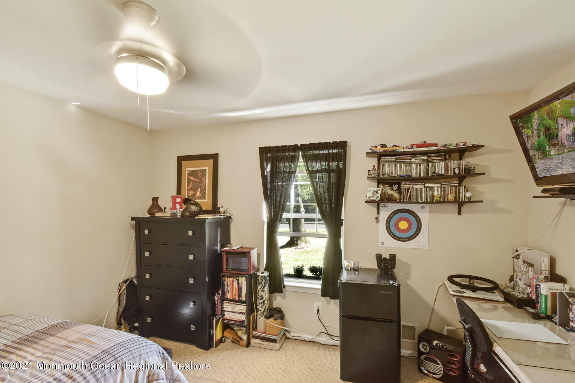 860 Fort Plains Road Howell, NJ 07731 - Photo 14 of 28 a bedroom with a bed and cabinets