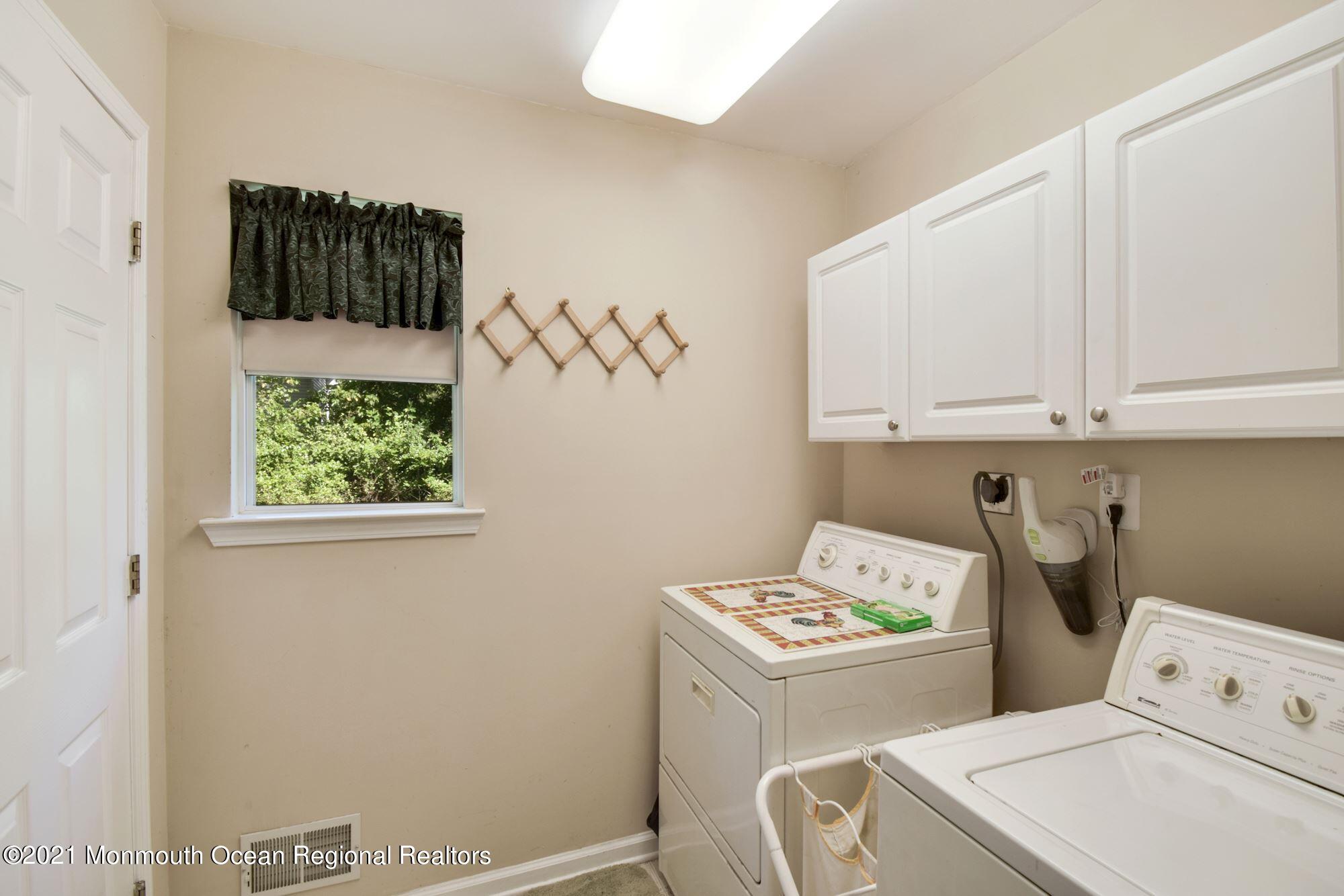 860 Fort Plains Road Howell, NJ 07731 - Photo 22 of 28 a utility room with dryer and washer