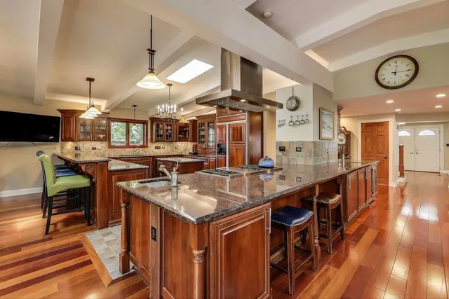 a view of a dining room with furniture and chandelier
