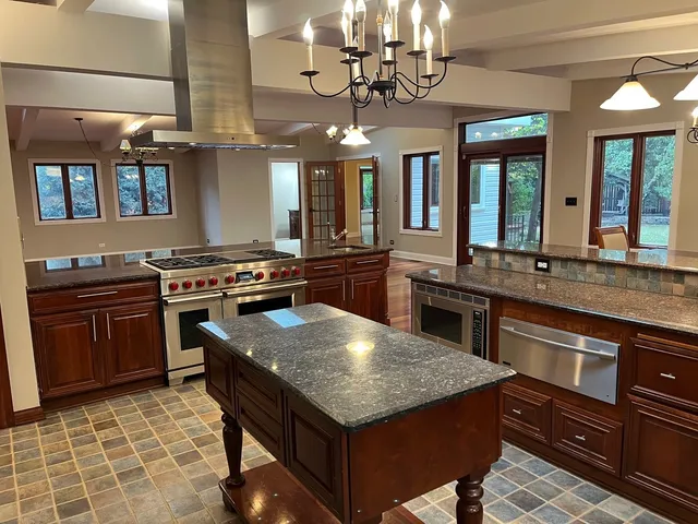 a living room with furniture ceiling fan and a rug
