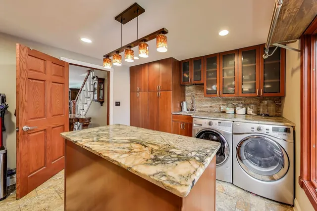 a backyard of a house with outdoor seating