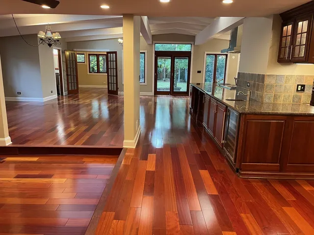 a view of a dining room with furniture and chandelier