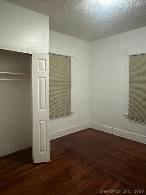 54 James Street, Unit 1 Bridgeport, CT 06604 - Photo 6 of 8 an empty room with wooden floor and closet