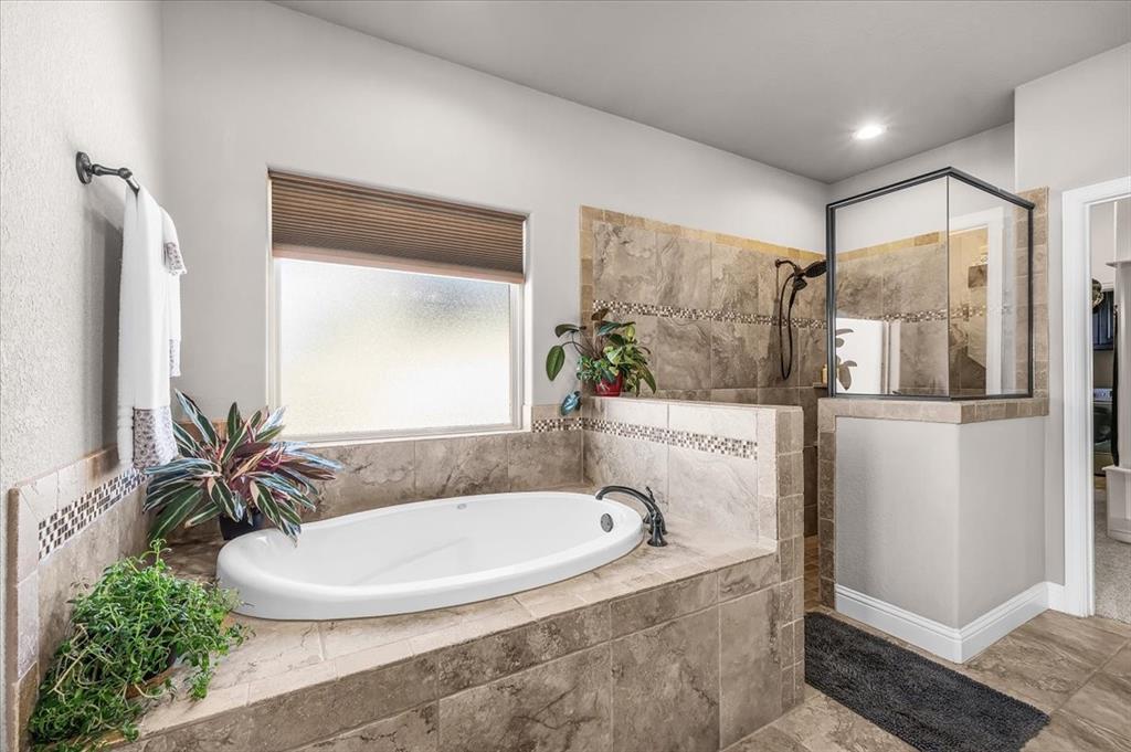 139 Stanford Lane Springtown, TX 76082 - Photo 18 of 36 Primary bathroom with large walk-in shower, and bathtub
