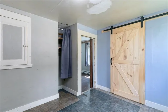a view of an entryway with wooden floor