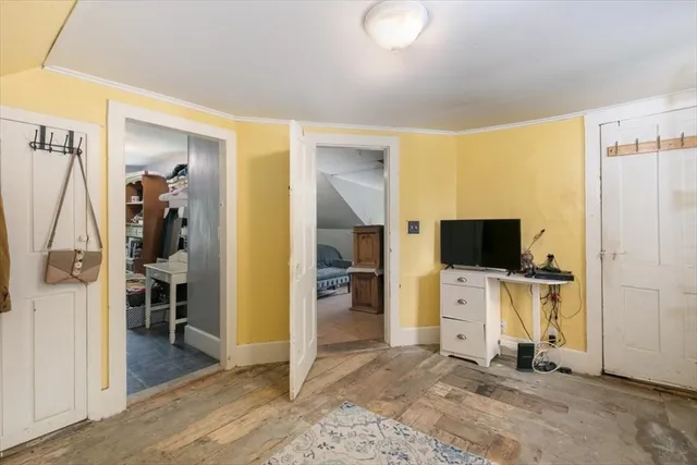 a view of a livingroom with a flat screen tv and a window