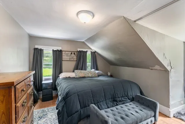 a bed room with a bed and a window