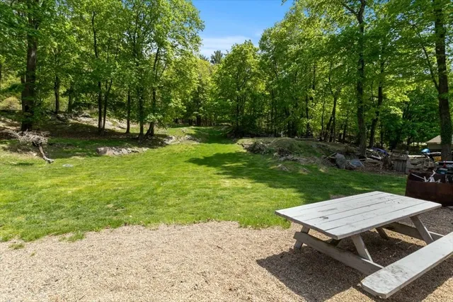 a wooden bench sitting in the middle of a park