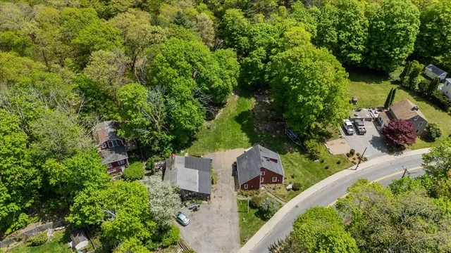 an aerial view of a house with a yard