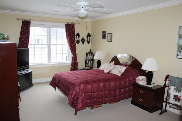 a bedroom with a bed and a dresser