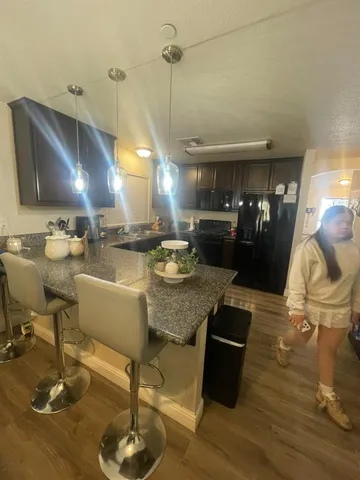 a room with lots of chairs and mirrors